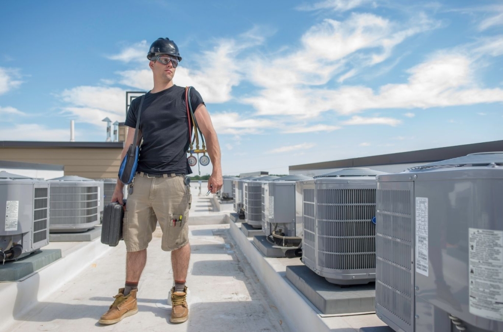 Experienced HVAC technician testing electrical and airflow issues during urgent cooling repair