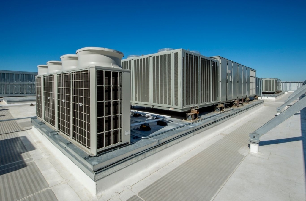 Rooftop HVAC units under a clear sky.