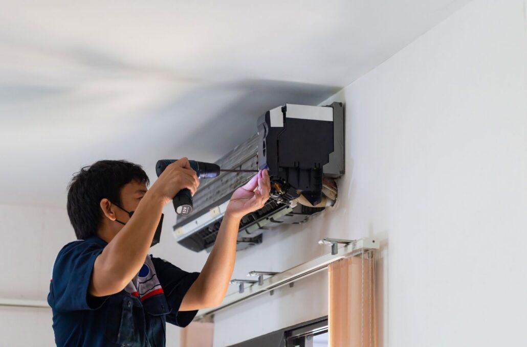 A/C Doctors Inc. expert drilling to mount a new AC unit in Vero Beach South, FL. AC Installation Near Me.